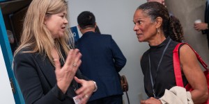 Two women are talking to each other.